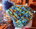 Chunky Monkey Pom Pom Hand Knit Hat-Greens, Blues & Golds/Navy Blue Pom-Pom