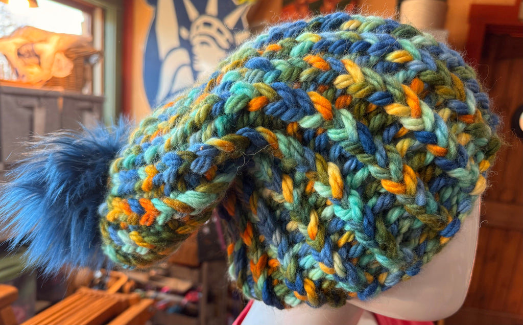 Chunky Monkey Pom Pom Hand Knit Hat-Greens, Blues & Golds/Navy Blue Pom-Pom
