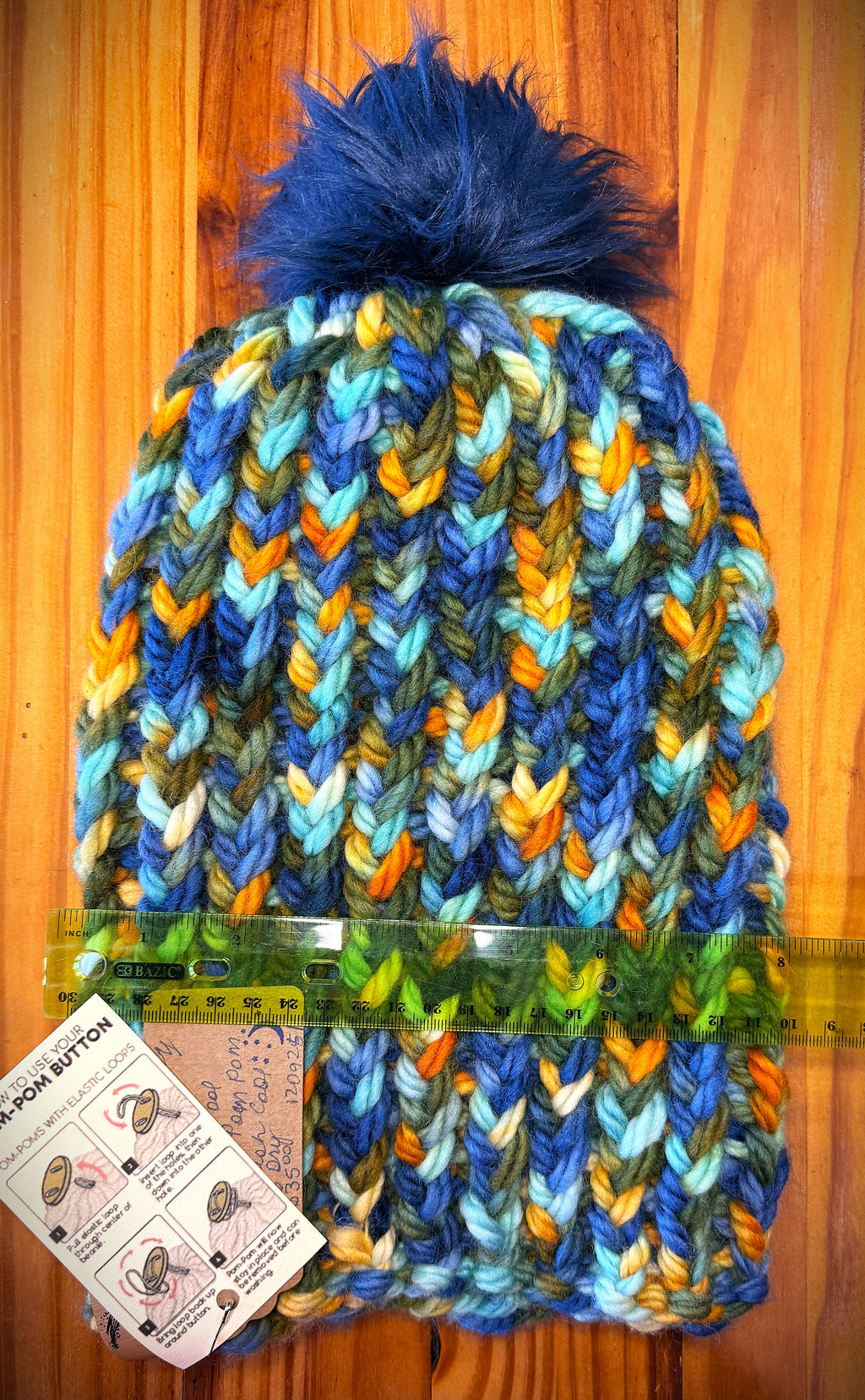 Chunky Monkey Pom Pom Hand Knit Hat-Greens, Blues & Golds/Navy Blue Pom-Pom